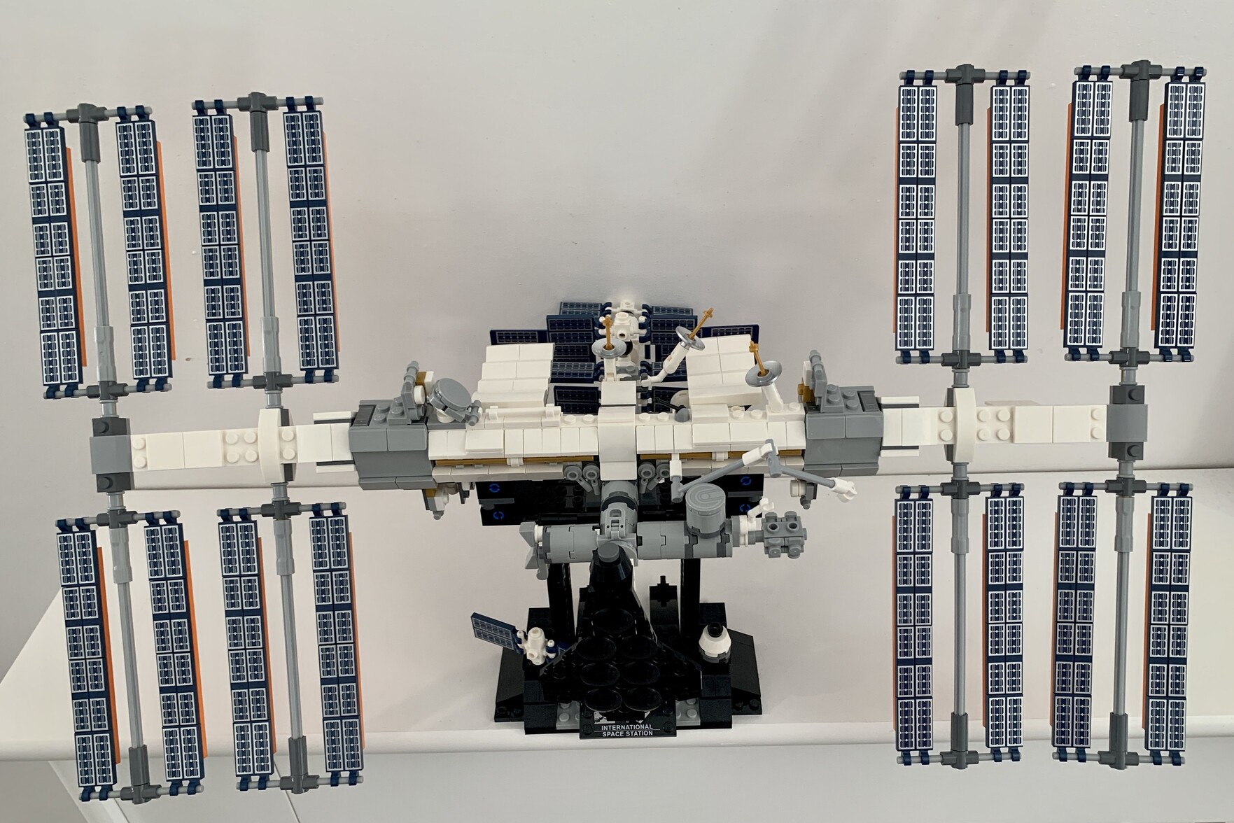 Built Lego International Space Station model on a black stand
