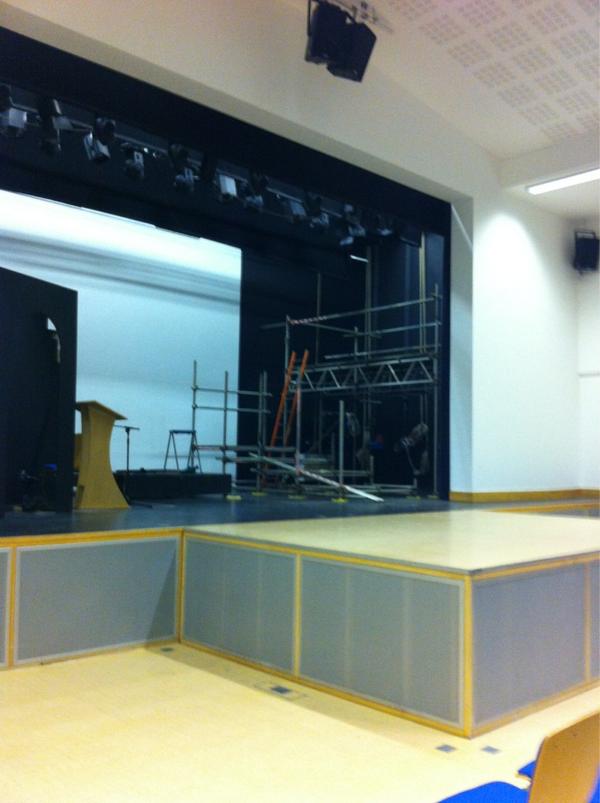 Photo of stage with scaffolding on it for us to sit on